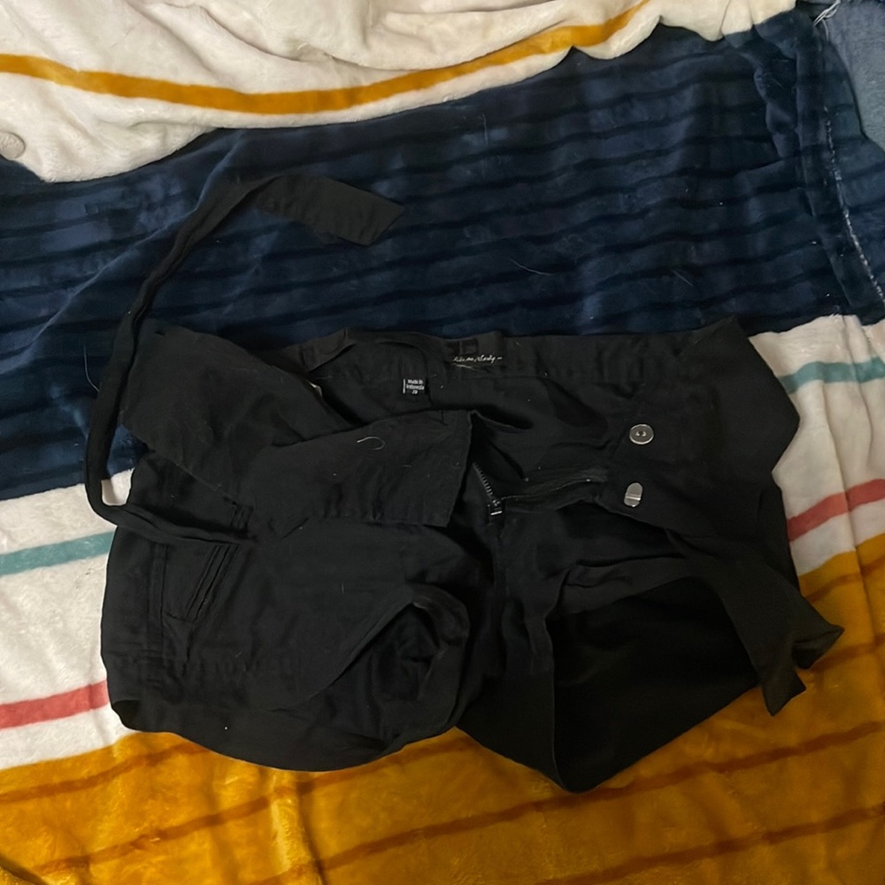 Black shorts can be low or high come with a belt never been worn but once